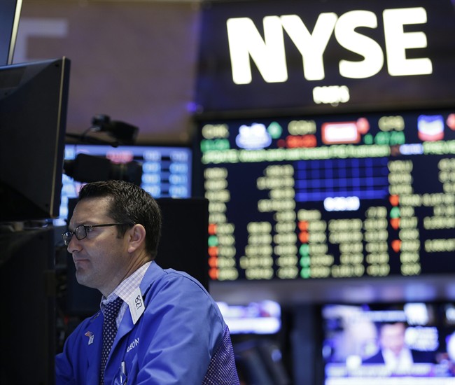 Traders work on the floor at the New York Stock Exchange.