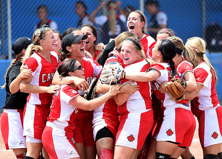 The Canadian team, lead by pitcher Sara Groenewegen, celebrates a 4-2 victory over the United States to win the gold medal in women's softball during the 2015 Pan Am Games at the President's Choice Ajax Pan Am Ballpark on July 26, 2015.  
