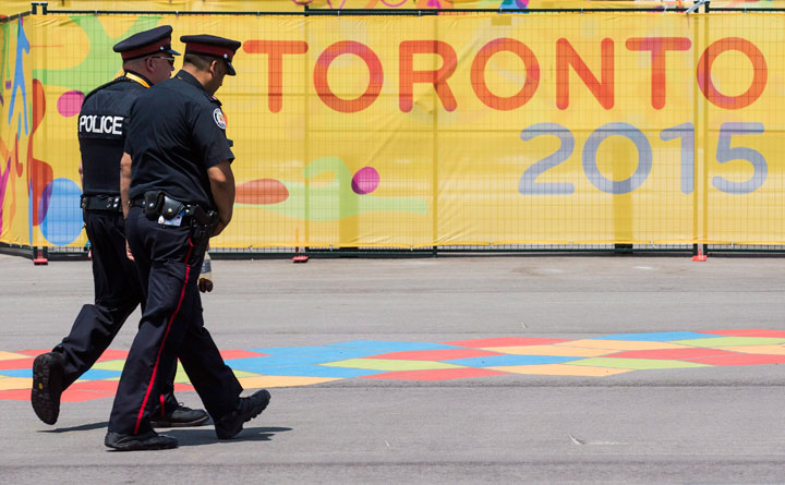 Police patrol inside the Pan American Games athletes village as security ramps before the games in Toronto, Friday July 3, 2015.