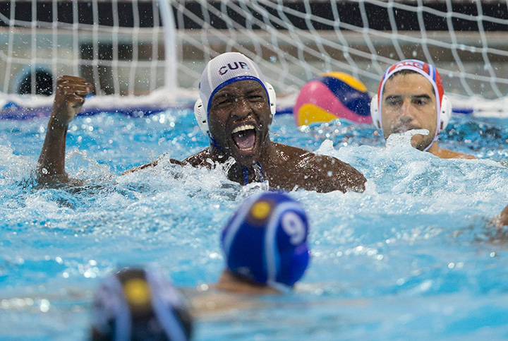 Cuba’s Rudy Despaigne celebrates after scoring against Argentine goalkeeper Hernan Mazzini at the Pan Am Games in Markham, Ontario on July 9, 2015.