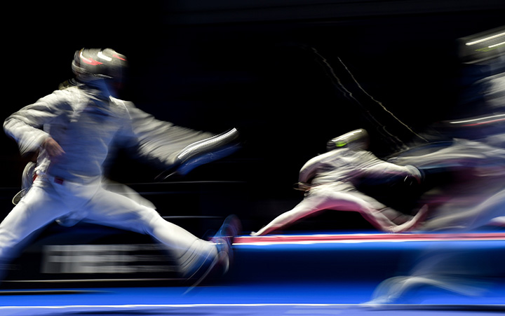 Russia's Veniamin Reshetnikov (L) fences against Italy's Diego Occiuzzi during the men's sabre individual round at the 2015 World Fencing Championships in Moscow on July 14, 2015. 