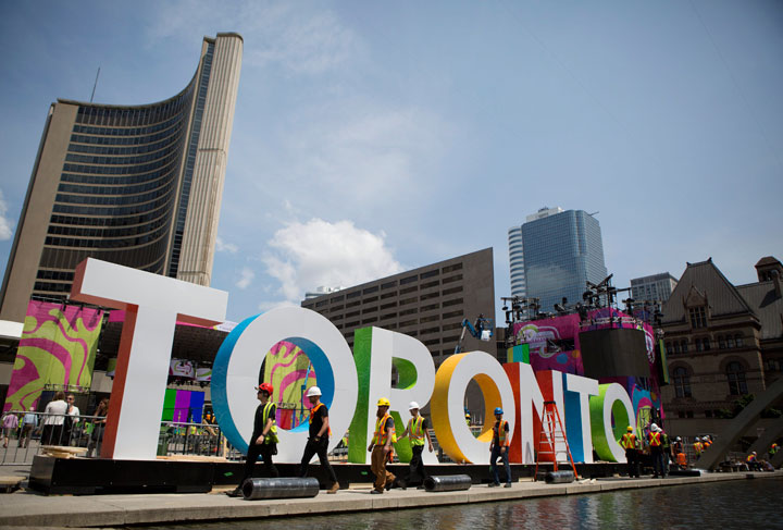 Workers erect giant letters spelling out Toronto in Nathan Phillips Square as they prepare for the Pan Am Games, Wednesday, July 8, 2015. The 2015 Pan Am Games officially open in Toronto on July 10.