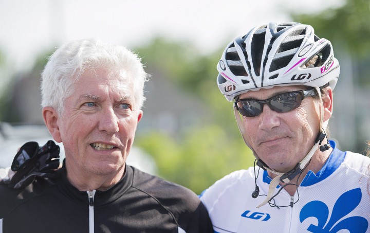 Bloc Québecois leader Gilles Duceppe, right, talks with Parti Québecois leader Pierre Karl Péladeau prior to setting off on their bicycles in Repentigny, Que., Wednesday, July 29, 2015, for a tour of some regions of Quebec.