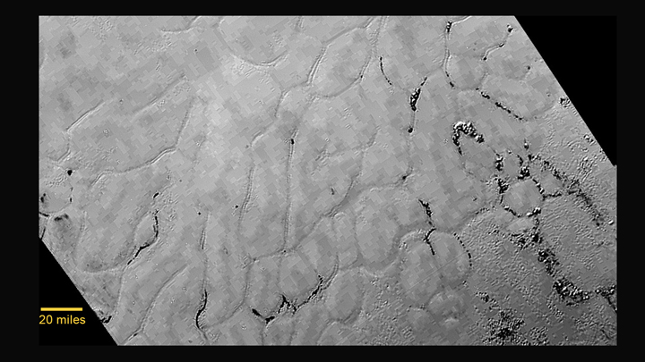 In the centre left of Pluto’s vast heart-shaped feature – informally named “Tombaugh Regio” – lies a vast, craterless plain that appears to be no more than 100 million years old, and is possibly still being shaped by geologic processes.