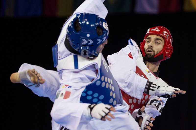 Canada's Maxime Potvin (right) competes against Mexico's Saul Gutierrez during his silver medal performance in the men's -68kg final taekwondo match at the Pan Am games in Mississauga, Ont., on Monday, July 20, 2015. 
