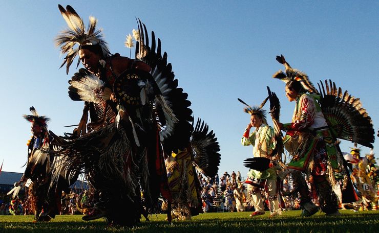 Native Americans dance in the grand entry of the Julyamsh Pow Wow in Post Falls, Idaho on July 23 2004. The Julyamsh is touted as the largest pow wow in the Northwest.