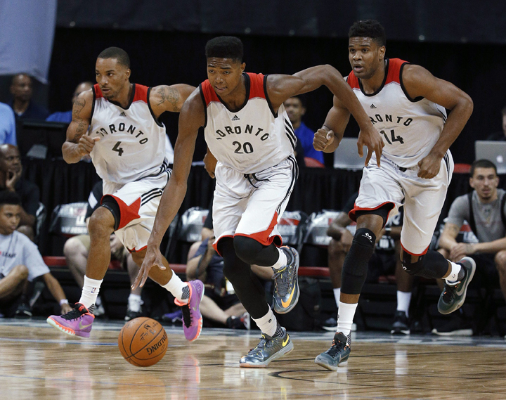 Toronto Raptors’ Bruno Caboclo, center, drives up the court with teammates Norman Powell, left, and Ronald Roberts during the first half of an NBA summer league basketball game against the Sacramento Kings on Friday, July 10, 2015, in Las Vegas.