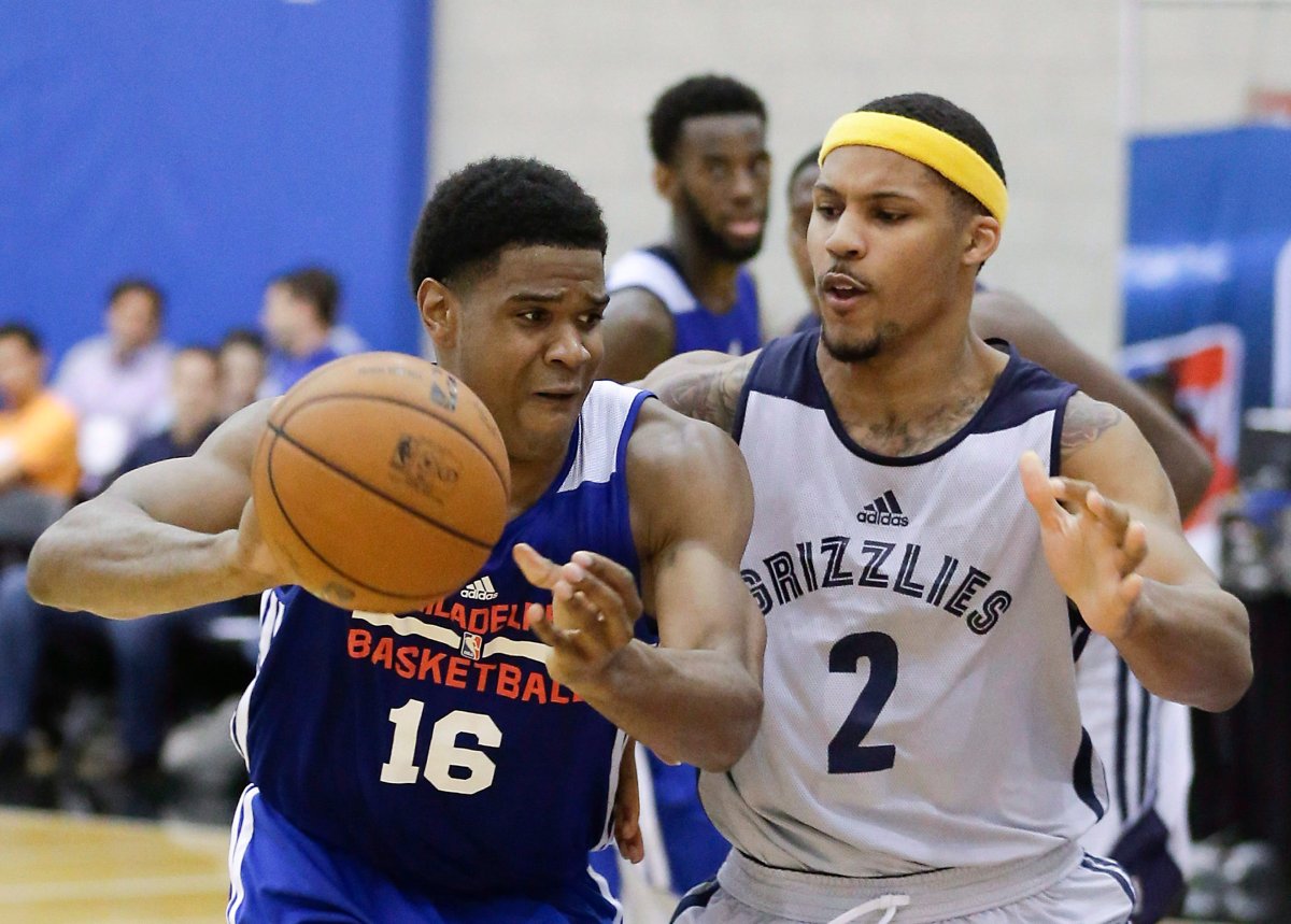 Philadelphia 76ers' Ronald Roberts Jr. (16) passes the ball as he is guarded by Memphis Grizzlies' Jarnell Stokes (2) during an NBA summer league basketball game in Orlando, Fla., on July 11, 2014. 