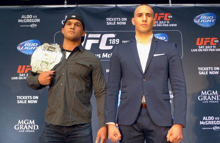 UFC welterweight champion (Ruthless) Robbie Lawler, left, and Montreal-based challenger Rory MacDonald pose for a photo at the UFC 189 World Championship Tour in Toronto on Friday, March 27, 2015.