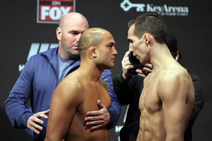 BJ Penn, left, and Rory MacDonald are separated by UFC President Dana White during the weigh-in for their mixed martial arts bout at the UFC on FOX 5 event in Seattle, Friday, Dec. 7, 2012.