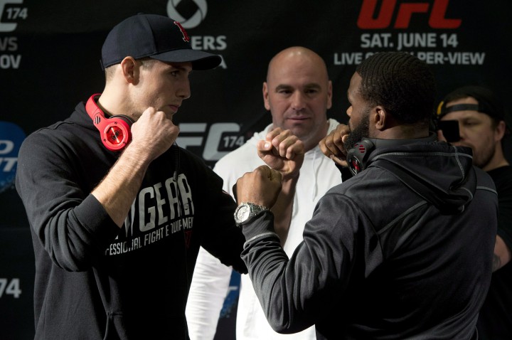 Rory MacDonald of Canada, left, and Tyron Woodley of the United States pose during their faceoff UFC at EA Sports in Burnaby, B.C. Thursday, June, 12, 2014.