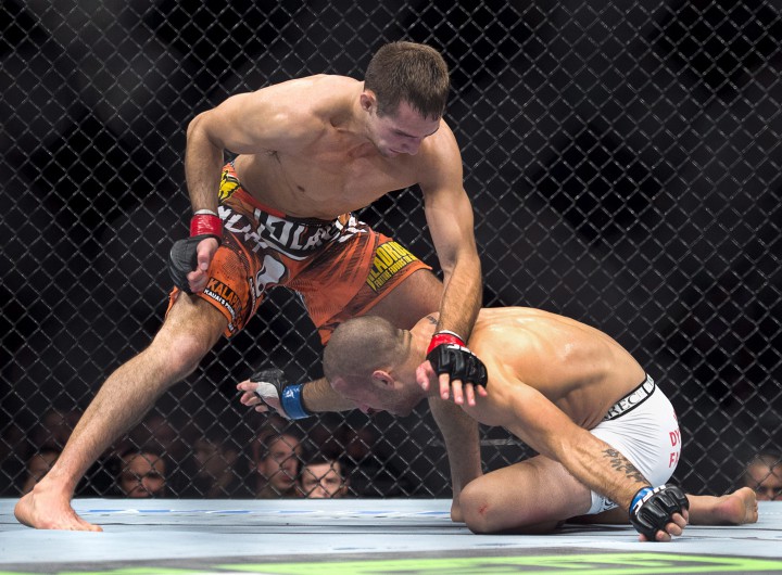 Rory MacDonald, left, battles Tarec Saffiedine in their welterweight bout at UFC Fight Night 4 in Halifax Saturday, October 4, 2014. MacDonald won after the referee stopped the fight in the third round.