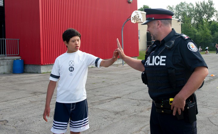 Toronto police Sgt. Matthew Routh with Andre Lam.