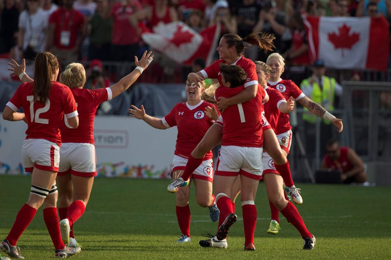 Ashley Steacy jumps into the arms of teammate Brittany Benn after winning Pan Am Games gold.
