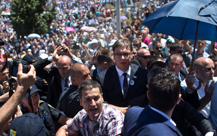 Aleksandar Vucic, Serbia's prime minister, center, is seen during a scuffle at the Potocari memorial complex near Srebrenica, 150 kilometers northeast of Sarajevo, Bosnia and Herzegovina, Saturday, July 11, 2015.