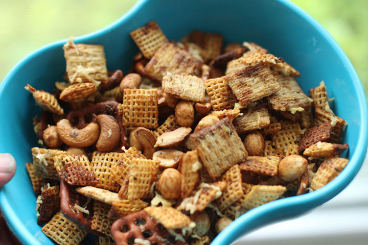 This June 15, 2015 photo shows cheesy toasted snack mix in Concord, N.H. This dish is from a recipe by Alison Ladman.