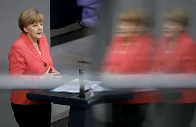 German Chancellor Angela Merkel gestures during her speech as part of a meeting of the German federal parliament, Bundestag, in Berlin, Germany, Friday, July 17, 2015. Merkel is asking German lawmakers to clear the way for negotiations on a new, third bailout package for Greece, arguing that it would be negligent not to try for a deal. (AP Photo/Michael Sohn).