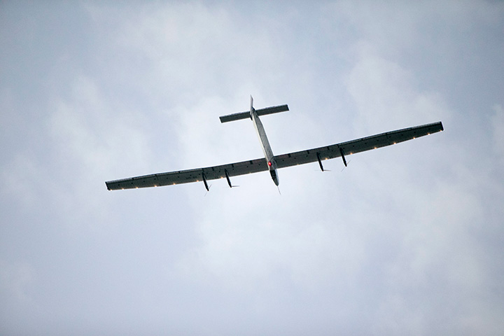 The Solar Impulse 2, a solar-powered airplane, circles the Kalaeloa Airport, Friday, July 3, 2015, in Kapolei, HI.