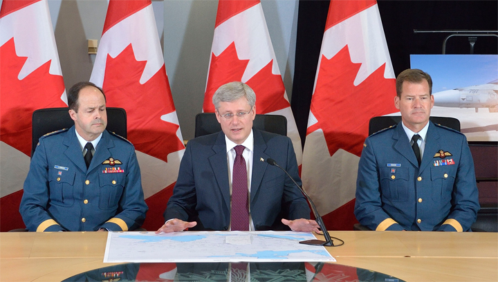 Prime Minister Stephen Harper, with Michael Hood to his left, announces measures Canada will take to promote security and stability of Central and Eastern Europe on April 17 2014 in Ottawa, Ontario.