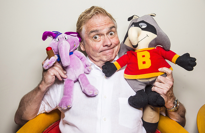 Kevin Gillis, creator of 'The Raccoons', pictured on July 2, 2015 with plush characters from the show.