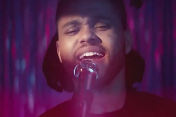 The Weeknd, pictured in a scene from the video for "Can't Feel My Face.".