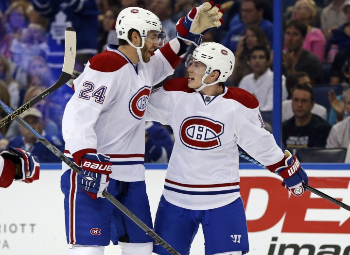 Montreal Canadiens' Brendan Gallagher, right, celebrates his goal with Jarred Tinordi during the first period of an NHL hockey game against the Tampa Bay Lightning in Tampa, Fla., on Oct. 13, 2014.