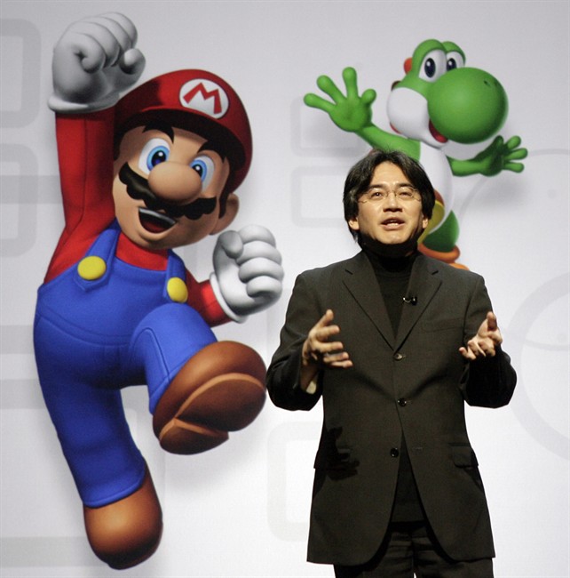 FILE - In this July 15, 2008 file photo, Satoru Iwata, President and CEO of Nintendo Co. Ltd., speaks at a news conference where Nintendo unveiled an enhancement for its Wii Remote controller and new games at the E3 Media and Business Summit in Los Angeles. Nintendo said President Iwata died Saturday, July 11, 2015, of a bile duct tumor in a Kyoto hospital, western Japan. (AP Photo/Ric Francis, File).