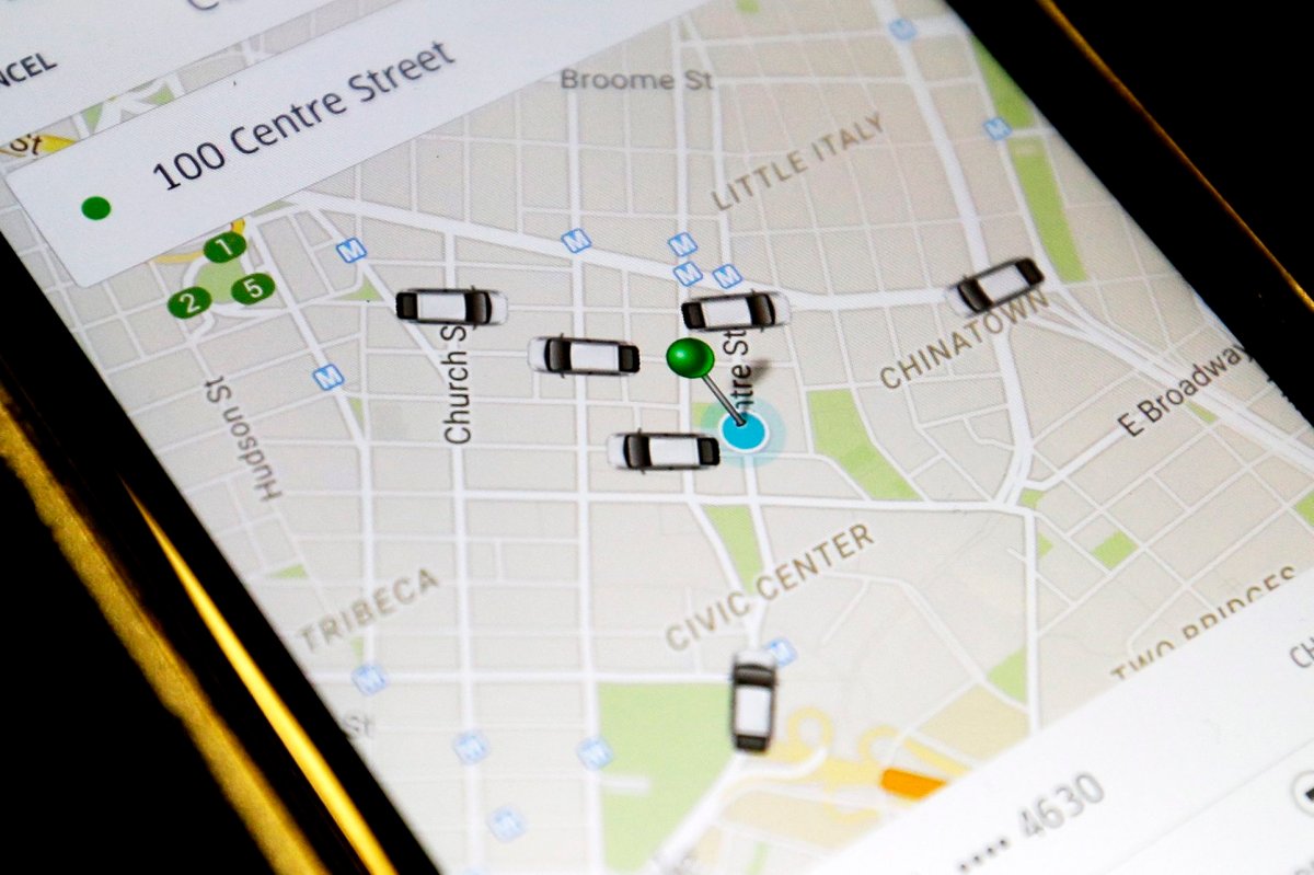In this Wednesday, March 18, 2015 file photo, on a cell phone in New York, the Uber app displays cars available for a pick up at 100 Centre St., a few blocks from City Hall.
