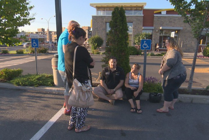 Vanessa Higgins sits with friends at family at the McDonald's in Lasalle on Thursday, July 16, 2015.