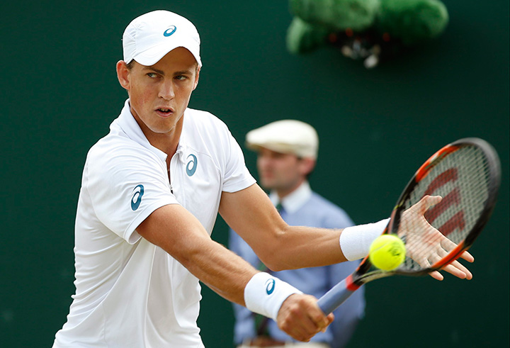 Canada’s Vasek Pospisil returns a ball to Viktor Troicki of Serbia during their singles match at the All England Lawn Tennis Championships in Wimbledon, London on Monday July 6, 2015. 