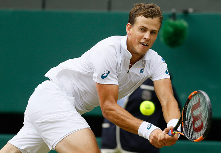 Canada’s Vasek Pospisil returns a shot to Andy Murray of Britain during the men's quarterfinal singles match at the All England Lawn Tennis Championships in Wimbledon, London on Wednesday July 8, 2015. 