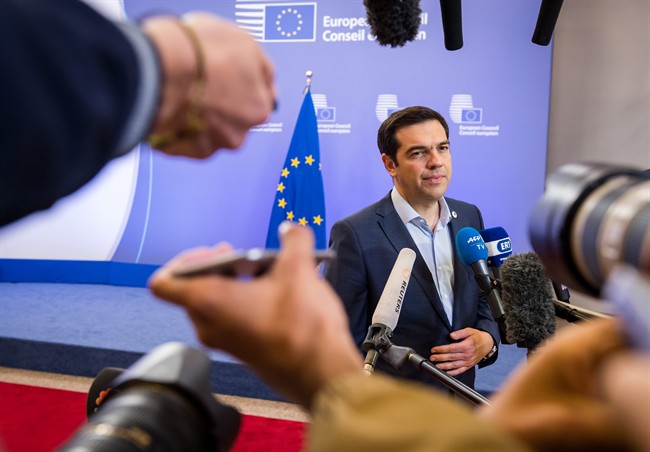 Greek Prime Minister Alexis Tsipras speaks with the media after a meeting of eurozone heads of state at the EU Council building in Brussels on Monday, July 13, 2015.