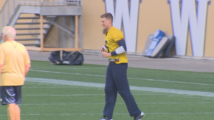 Winnipeg Blue Bombers quarterback Drew Willy grimaces while jogging before Tuesday's practice.