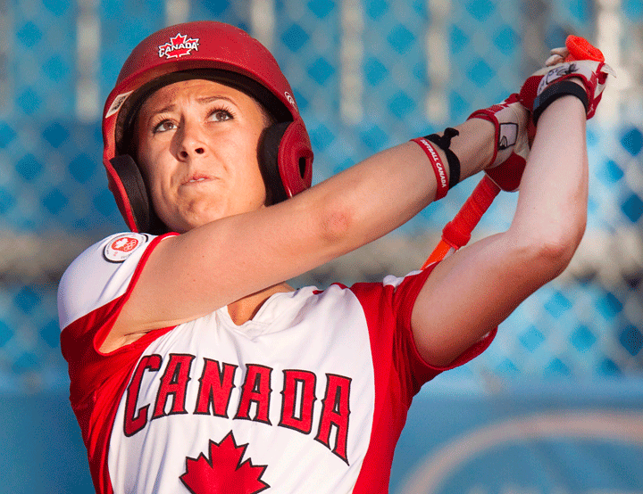 Canada's Erika Polidori hits a ball to left field to drive in a run but was called out at third trying to stretch a triple in the third inning of their women's softball at the Pan American Games against USA in Toronto on Friday July 24, 2015. 