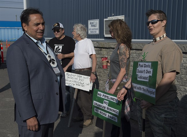 Perry Bellegarde, national chief of the Assembly of First Nations, talks with protesters at a meeting of Canadian premiers and national aboriginal leaders in Happy Valley-Goose Bay, Newfoundland and Labrador, on Wednesday.