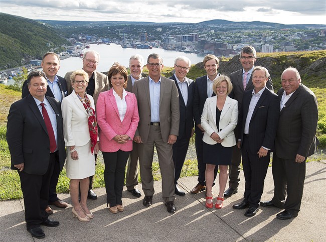 Canada's premiers pose for a group photo on Signal Hill overlooking the harbour at their summer meeting in St. John's on Thursday, July 16, 2015.