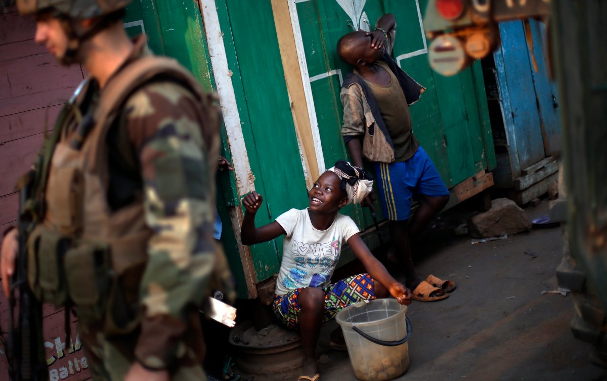 Children tease French peacekeepers in the PK12 district of Bangui, Central African Republic, Saturday Jan. 25, 2014. 
