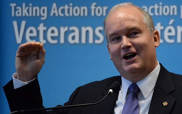 Erin O'Toole, Minister of Veterans Affairs, speaks during a Veterans Affairs stakeholder summit in Ottawa on Tuesday, April 14, 2015.