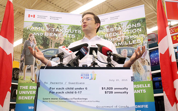 Employment Minister Pierre Poilievre talks about the increased payments to families as part of the Universal Child Care Benefit during a press conference in Fredericton, N.B., on Thursday, July 23, 2015.