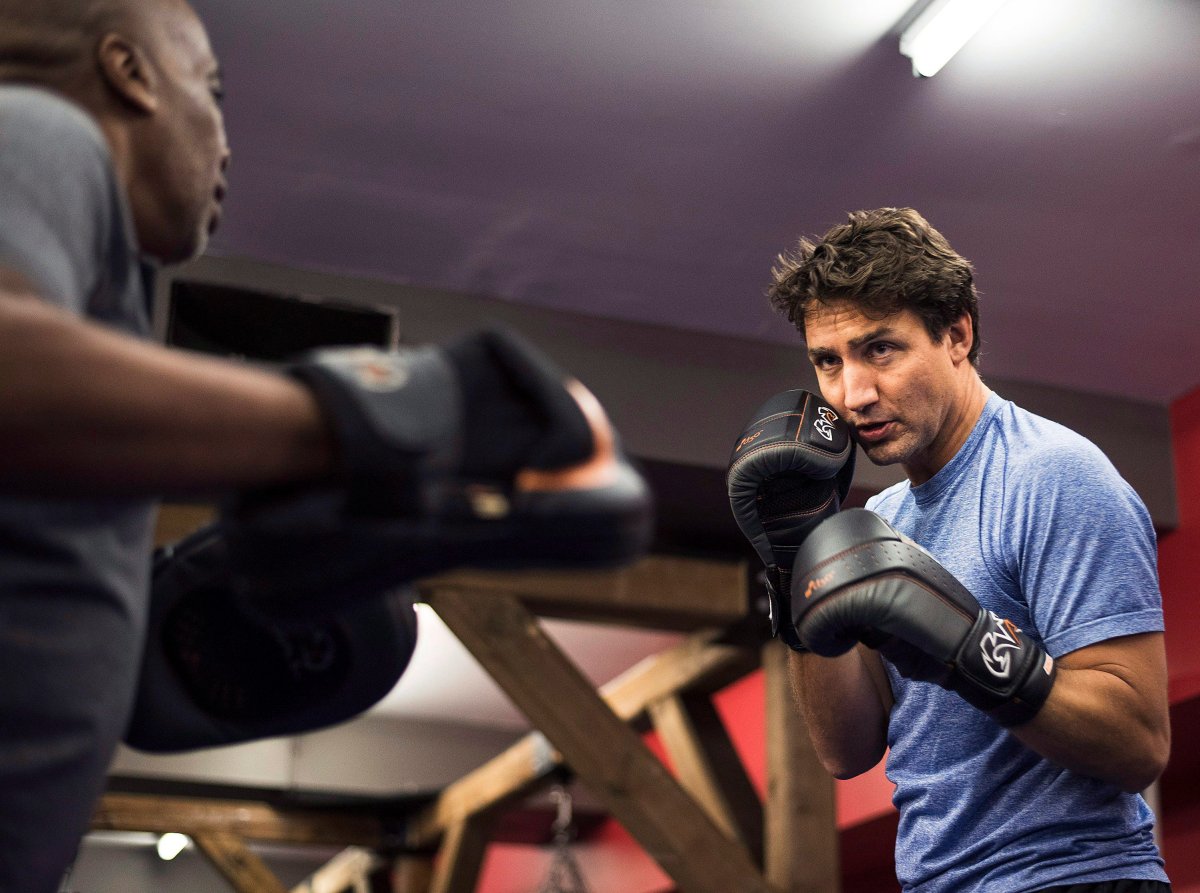 Liberal Leader Justin Trudeau warms up in the ring with Paul Brown during a photo op at Paul Brown Boxfit in Toronto on Thursday, August 6 2015 prior to the first election debate THE CANADIAN PRESS/Aaron Vincent Elkaim.