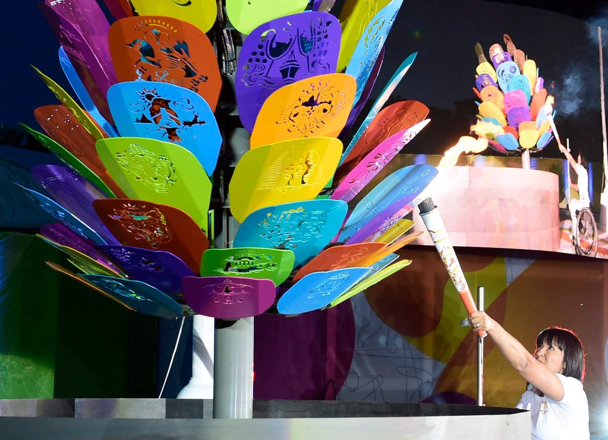 Chantal Petitclerc lights the games cauldron during the opening ceremony at the Parapan American Games in Toronto on Friday Aug. 7, 2015. 