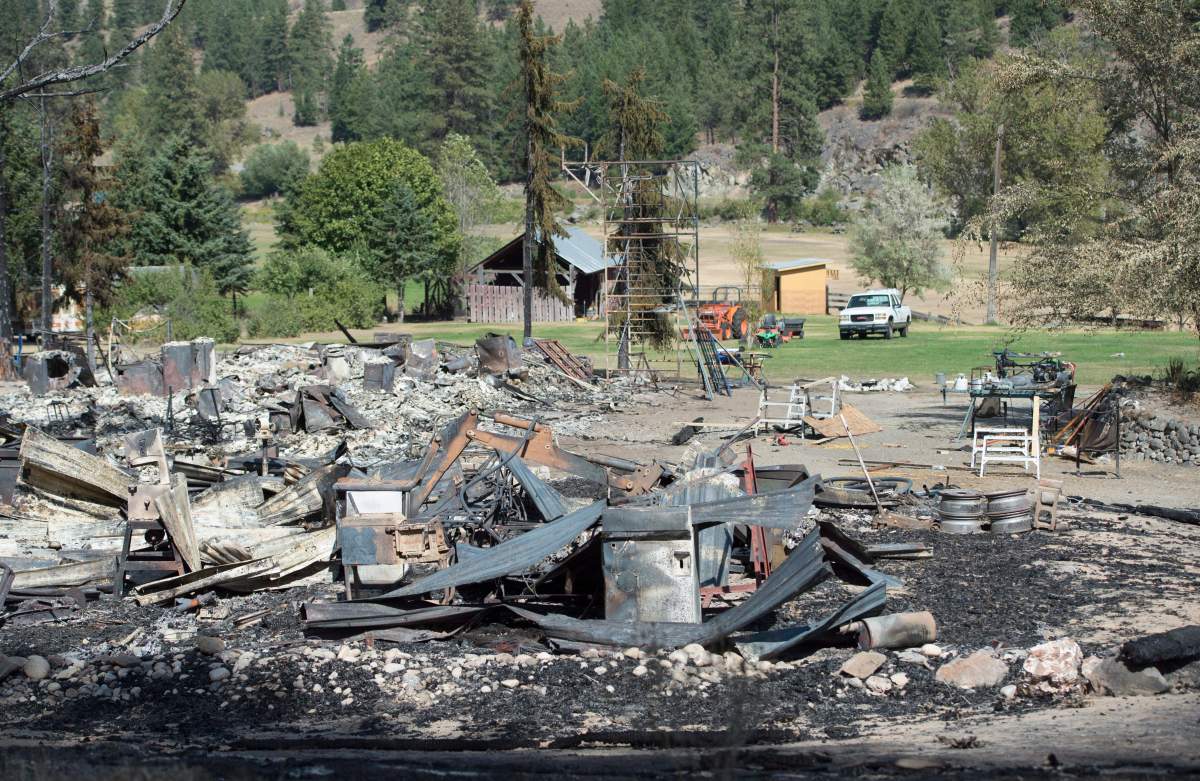 The remains of a burnt out building are seen in Rock Creek, B.C., on Sunday, August 15, 2015 after a wildfire tore through the area on Thursday.