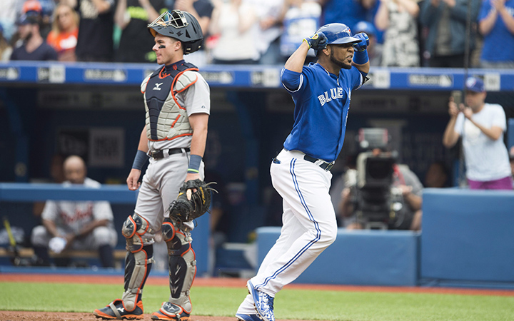 Toronto Blue Jays' Edwin Encarnacion, right, celebrates a three-run home run in front of Detroit Tigers' catcher James McCann during first inning MLB baseball action in Toronto on Saturday, August 29, 2015.