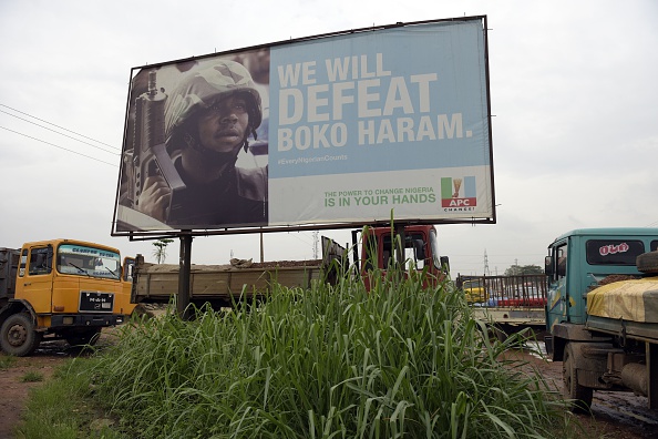 A photo shows a campaign signboad displayed by the ruling All Progressives Congress (APC) to show its readiness to defeat Boko Haram Islamists on assumption office at Ogijo, Ogun State in southwest Nigeria, on July 3, 2015. 