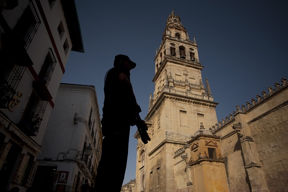 A member of the Spanish special police unit stands guard near the Mezquita, the Mosque-Cathedral of Cordoba on July 7, 2015. 