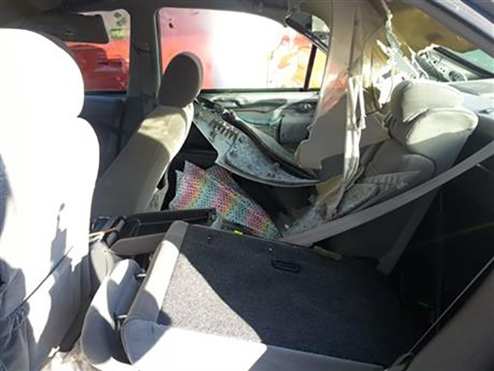 This Aug. 13, 2015, photo provided by Greg Creasy shows some of the damage caused to a Toyota Camry after a black bear broke into the car and became trapped, near Red Lodge, Mont., north of the eastern edge of Yellowstone National Park.