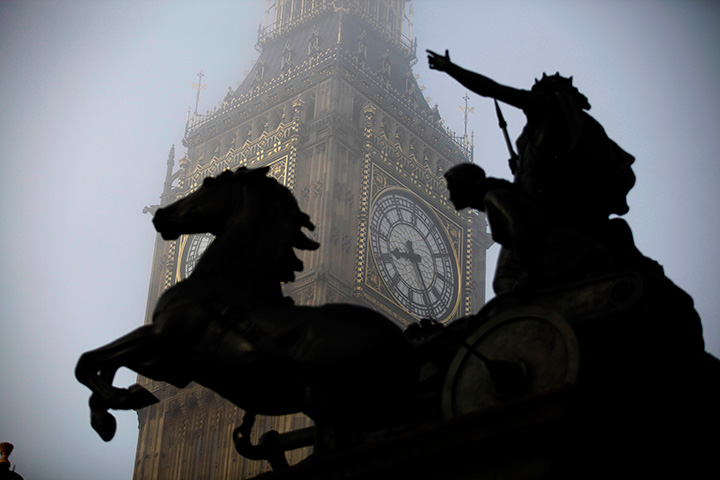The Boudicca statue stands in the foreground as fog shrouds the clock tower which houses the Big Ben bell at the Palace of Westminster, London. 