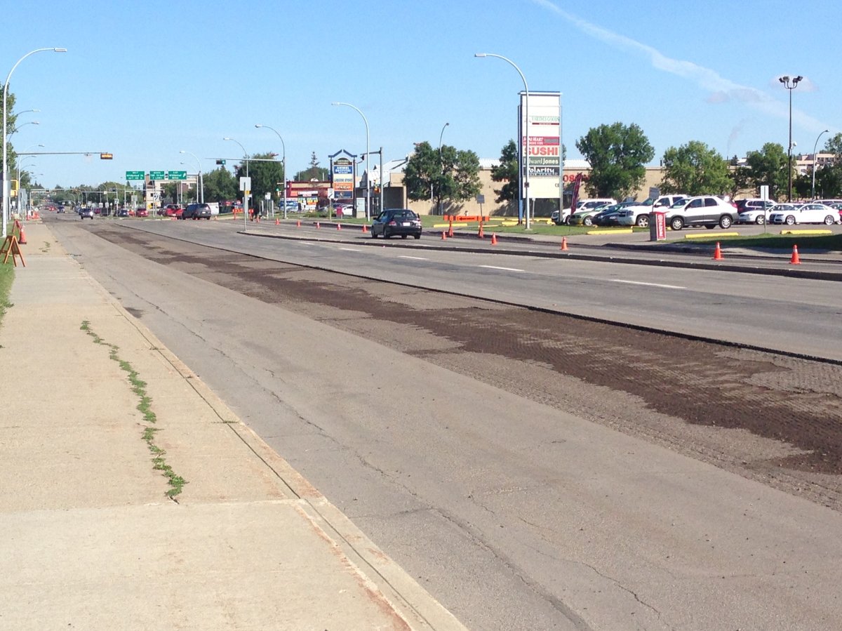 Crews begin to remove bike lanes in south Edmonton, Tuesday, August 18, 2015. 