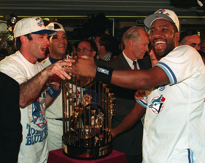Toronto Blue Jays Paul Molitor and Joe Carter stand with the World Series trophy in the Jays clubhouse after defeating the Philadelphia Phillies 8-6 to win their second straight World Series on Oct. 23, 1993.