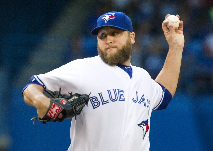 Toronto Blue Jays starting pitcher Mark Buehrle throws against the Minnesota Twins during first inning AL baseball action in Toronto on Thursday August 6, 2015. 